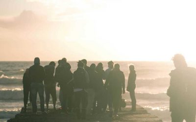 crowd standing on dock