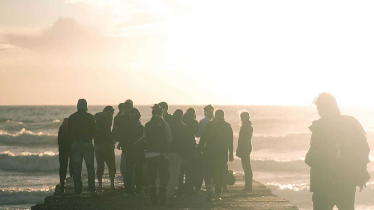 crowd standing on dock