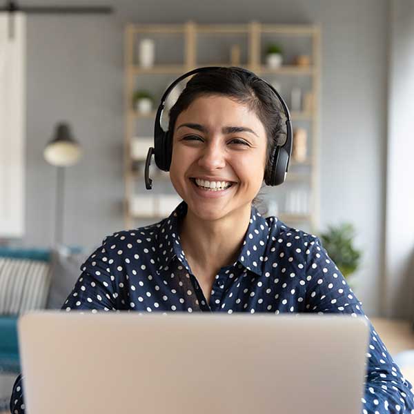 lady with headphones working at computer