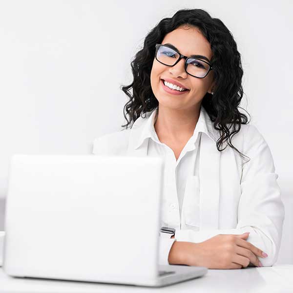 woman in glasses working in office