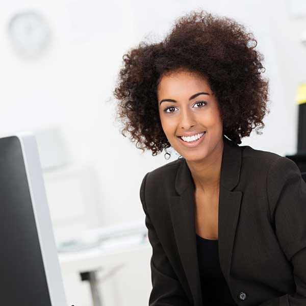 smiling woman working at desk